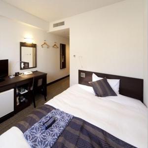 Ένα ή περισσότερα κρεβάτια σε δωμάτιο στο Silk Inn Kagoshima
