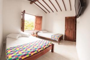 Postel nebo postele na pokoji v ubytování Vivienda turística mi sueño Jardín + 8 fotografií