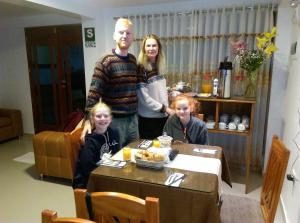 a man and two girls standing next to a table at Picos House MachuPicchu in Machu Picchu +63 photos