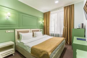 Voodi või voodid majutusasutuse Grand Sapphire Hotel toas