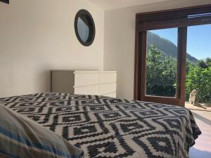 Postel nebo postele na pokoji v ubytování La Villa Te Fetia Nui Moorea
