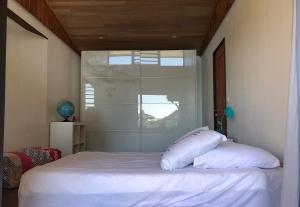 Postel nebo postele na pokoji v ubytování La Villa Te Fetia Nui Moorea