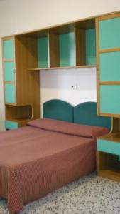a bedroom with two beds in a room at Residence Ducale in Rodi Garganico