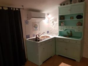 A kitchen or kitchenette at Casa Maria