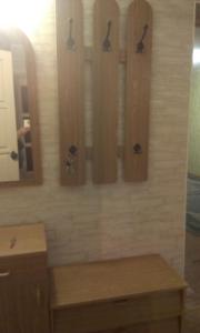 a bathroom with a counter and a mirror and a sink at Apartment Chernihivska 13 in Shostka