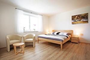 Posteľ alebo postele v izbe v ubytovaní Apartmány Lipno 510 + 35 fotografií