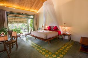 Postel nebo postele na pokoji v ubytování Mekong Home + 37 fotografií