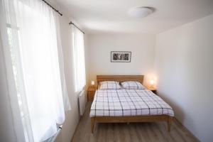 Posteľ alebo postele v izbe v ubytovaní Apartmány Lipno 510