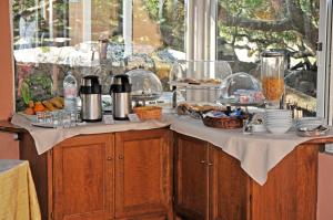 a table with food on top of a counter at Hotel Il Piccolo Golf in Porto Cervo