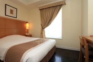 Postel nebo postele na pokoji v ubytování Hotel Monterey Lasoeur Ginza