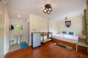 En eller flere senge i et værelse på Thong Nai Pan Beach Residence