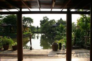 a view of a river from the porch of a house at Baan Thai House in Phra Nakhon Si Ayutthaya