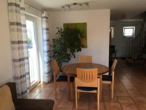 a dining room with a table and chairs at Apartment Carmen in Rust