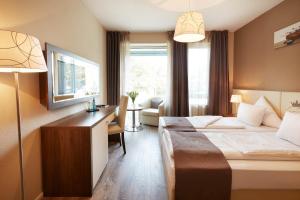 Postel nebo postele na pokoji v ubytování Empress Boutique Hotel