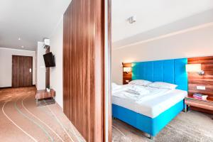 Posteľ alebo postele v izbe v ubytovaní Apartamenty AmberHome