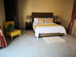 Voodi või voodid majutusasutuse Mmakgabo Boutique Lodge toas