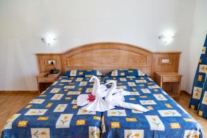 Cama o camas de una habitación en Hotel Casa del Sol