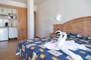 Cama o camas de una habitación en Hotel Casa del Sol
