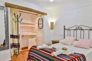Cama o camas de una habitación en Cuevas El Moral