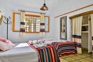 Cama o camas de una habitación en Cuevas El Moral