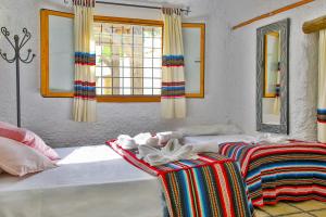 Cama o camas de una habitación en Cuevas El Moral