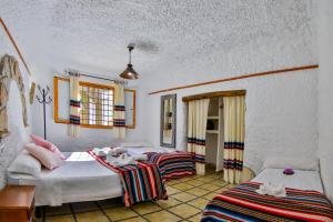 Cama o camas de una habitación en Cuevas El Moral