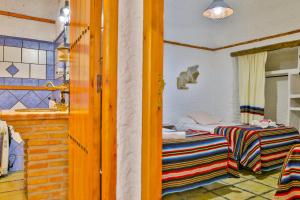 Cama o camas de una habitación en Cuevas El Moral