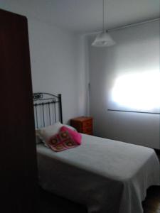Łóżko lub łóżka w pokoju w obiekcie Alcar