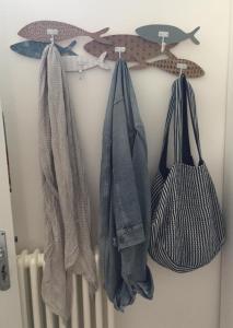 a group of towels hanging on a rack at Casa Mario in Cisternino