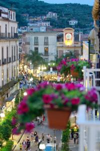 a view of a busy city street with a clock tower at Sorrento Flats in Sorrento