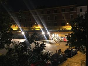 a view of a building at night with lights at Locanda San Cosimato in Rome