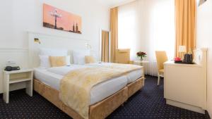 Postel nebo postele na pokoji v ubytování Hotel Fürst Bismarck