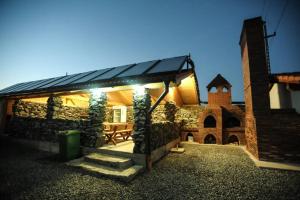 a house with a solarium on the side of it at motel cryss in Ocna Sibiului