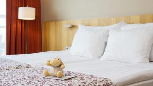 Ein Bett oder Betten in einem Zimmer der Unterkunft Hestia Hotel Europa