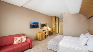 Ein Bett oder Betten in einem Zimmer der Unterkunft Hestia Hotel Europa