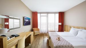 Ein Bett oder Betten in einem Zimmer der Unterkunft Hestia Hotel Europa