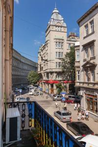 a view of a city street with cars and buildings at BV Apartments Black and White in Lviv
