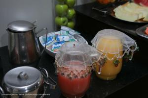 two drinks in plastic containers on a counter at Hotel Princeton in Piracicaba