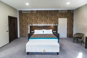 Postel nebo postele na pokoji v ubytování Bon Hotel