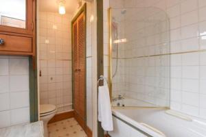 a bathroom with a tub and a toilet and a sink at Johnson Road Near Erdington Station in Birmingham