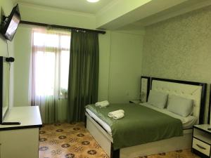 a bedroom with a large bed with a window at Dzorak in Halidzor