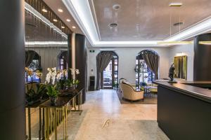 a lobby with a reception desk and a waiting room at Bon Hotel in Dnipro