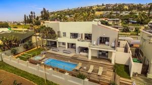 an aerial view of a house with a swimming pool at Vetho House Villa Ballito in Ballito