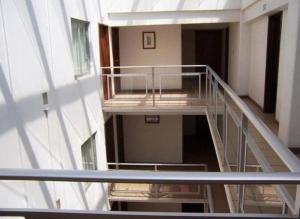 an empty stairwell of a building with a stair case at Hotel Don Pedro Centro in Villa de Tamazulapan
