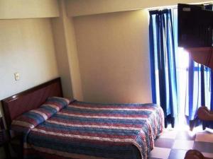 Postel nebo postele na pokoji v ubytování Hotel Don Pedro Centro