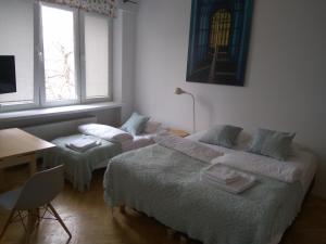 Posteľ alebo postele v izbe v ubytovaní Studio Iwicka