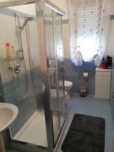 a bathroom with a shower and a toilet at Villa Fiorella in Sciacca +37 photos
