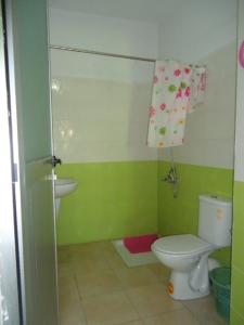 a bathroom with a toilet and a sink at Hotel Azul Palace in Sidi Yahia el Gharb