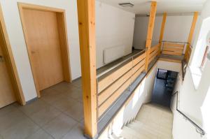 Posteľ alebo postele v izbe v ubytovaní Rodinný wellness hotel U Langrů