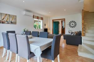 a dining room with a table and chairs at Casa Garcia in Sitges